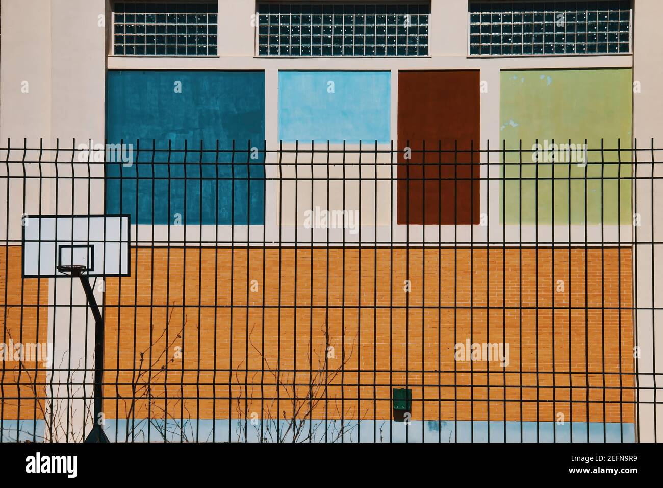 Basketball court in a high school. Facade in coloured geometric shapes Stock Photo