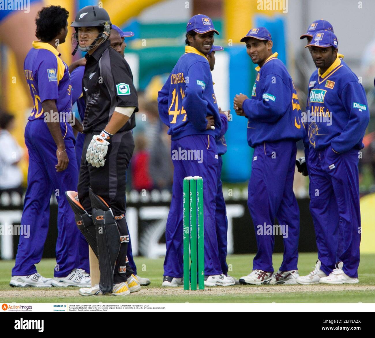 Cricket - New Zealand v Sri Lanka Third One Day International - Christchurch, New Zealand - 2/1/07  New Zealand batsman Ross Taylor (2nd L) waits umpires decision to confirm he is out as the Sri Lankan players look on  Mandatory Credit : Action Images / Simon Baker Stock Photo