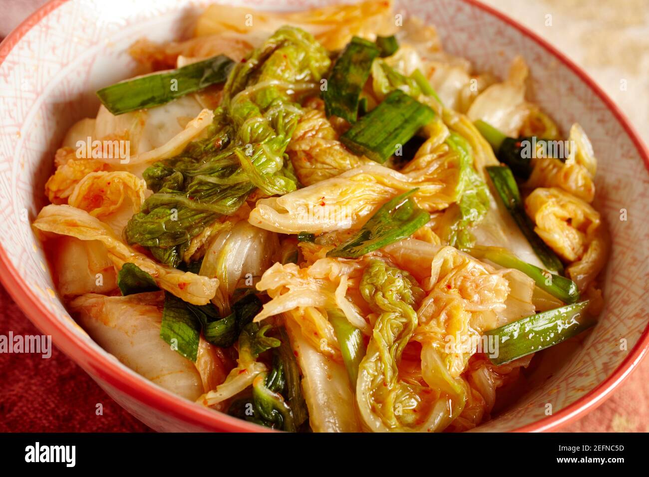 Kim Chi, pickled spicy napa cabbage with scallions, a staple food in Korea Stock Photo
