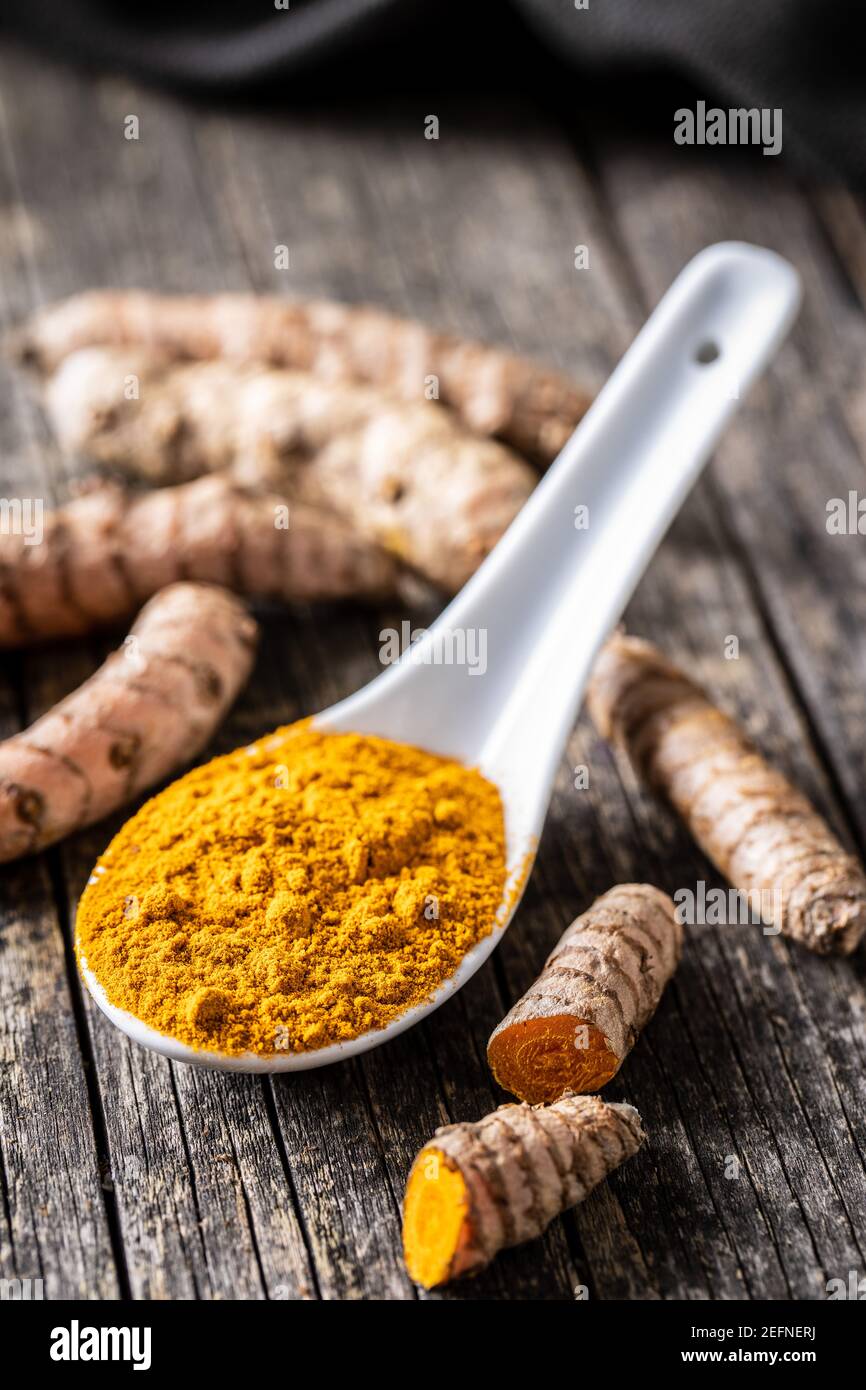 Trumeric India Indian turmeric powder and root. Turmeric spice. Ground turmeric in ...