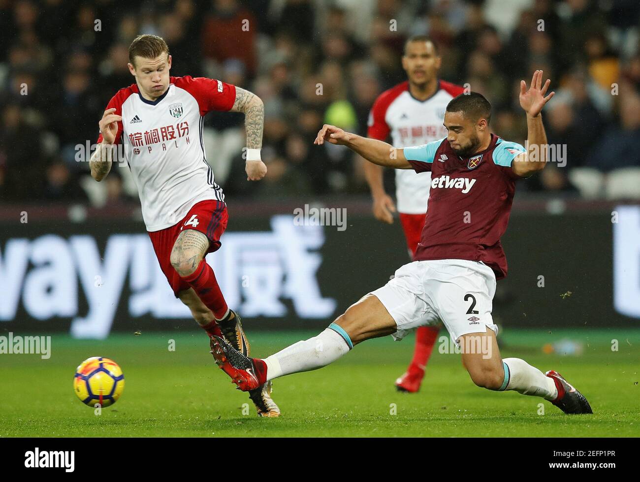 Soccer Football - Premier League - West Ham United vs West Bromwich Albion - London Stadium, London, Britain - January 2, 2018   West Bromwich Albion's James McClean in action with West Ham United's Winston Reid   REUTERS/Eddie Keogh    EDITORIAL USE ONLY. No use with unauthorized audio, video, data, fixture lists, club/league logos or 'live' services. Online in-match use limited to 75 images, no video emulation. No use in betting, games or single club/league/player publications.  Please contact your account representative for further details. Stock Photo
