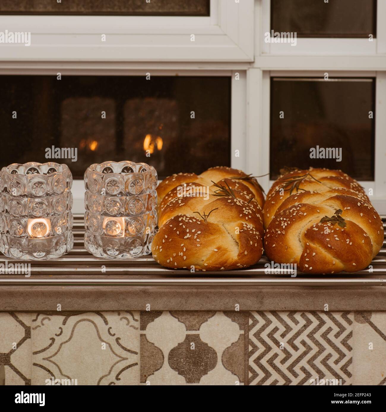 Shabbat image. Beautiful fresh challah bread and candles. Stock Photo