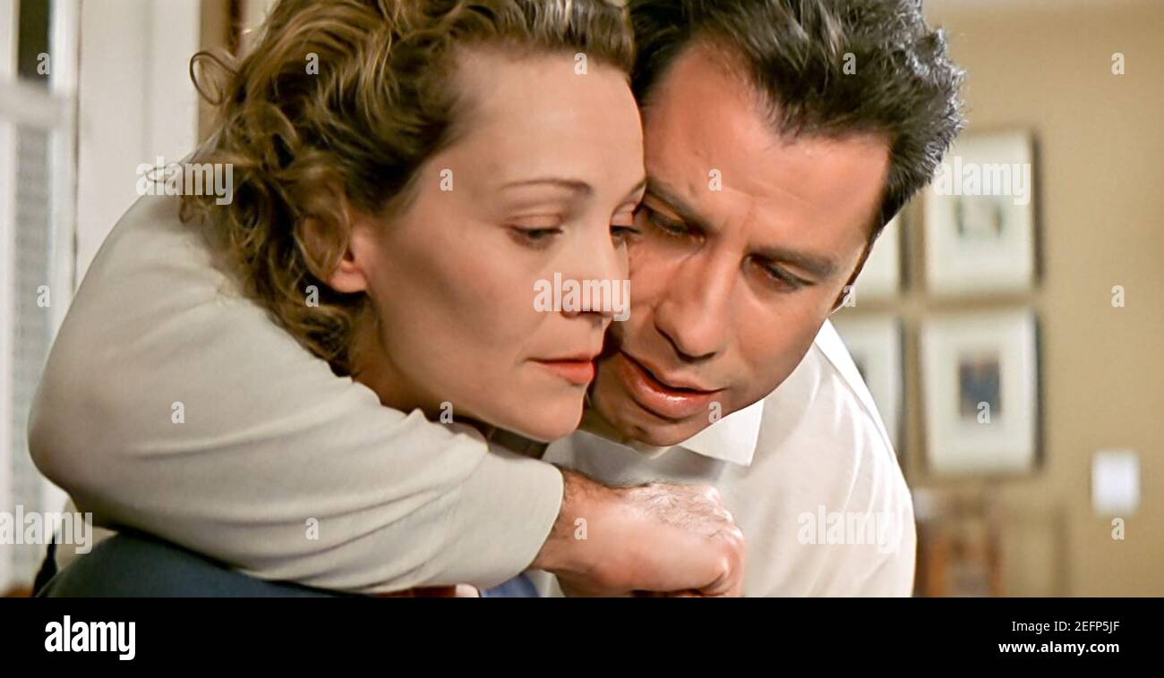 USA. Joan Allen and John Travolta in a scene from the (C)Paramount Pictures  film : Face/Off (1997). Plot: In order to foil a terrorist plot, an FBI  agent undergoes facial transplant surgery