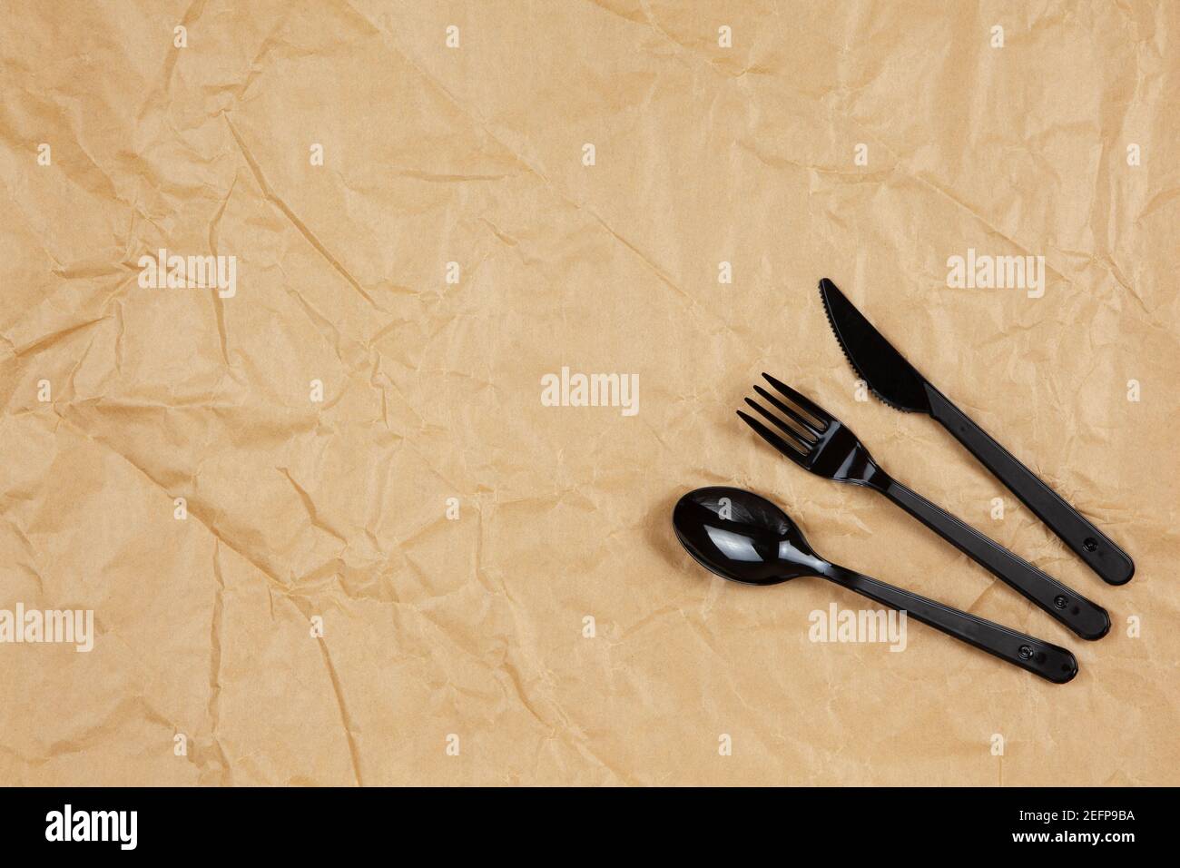 Reusable recyclable black fork, spoon, knife made from corn starch on