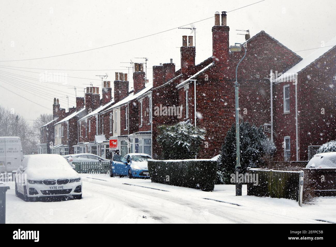 Wyberton west road during heavy snow, making travel difficult in Boston Lincolnshire. Stock Photo