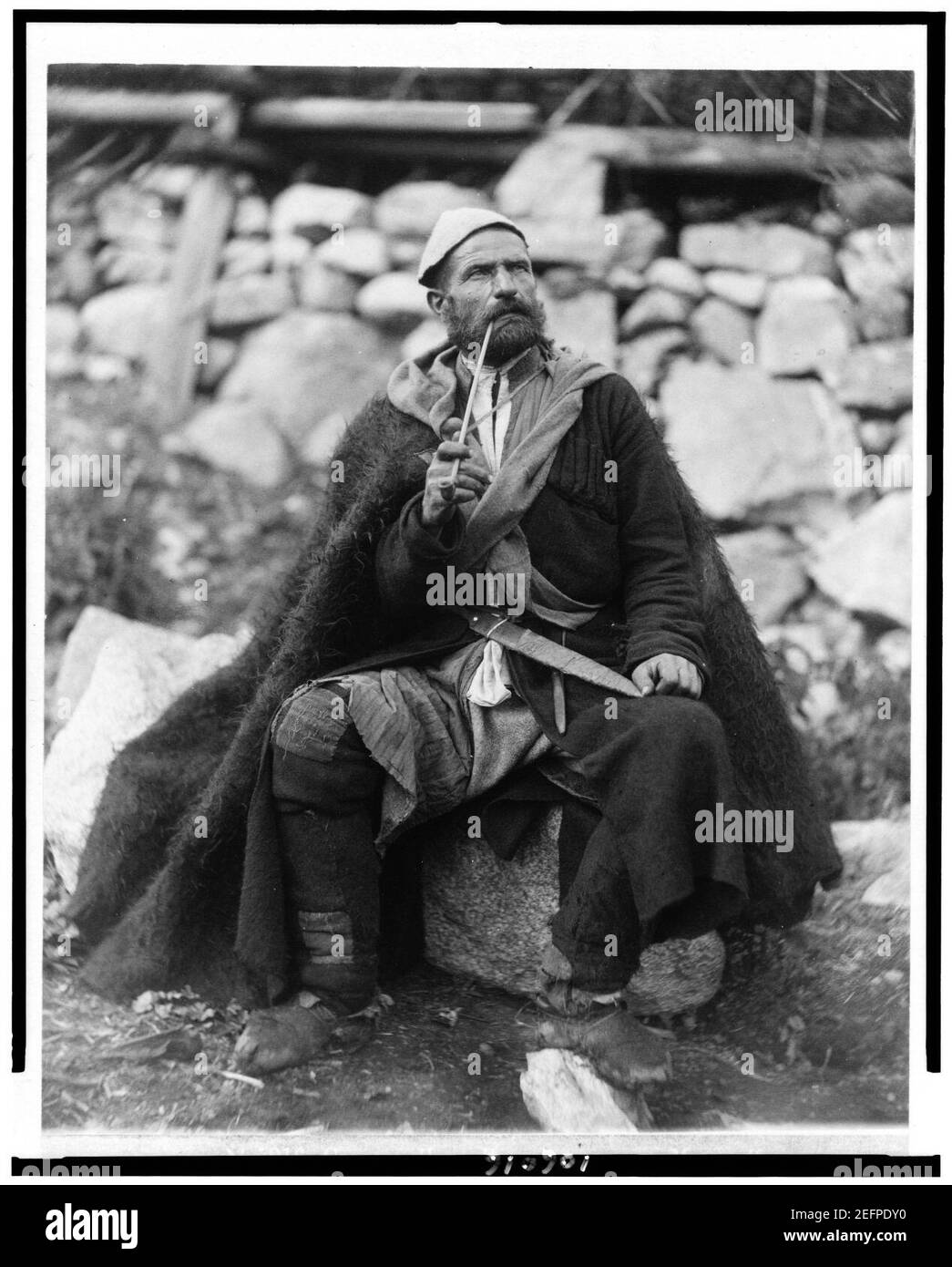 Old peasant with dagger and long smoking pipe, Mestia, Svanetia, Georgia (Republic) Stock Photo