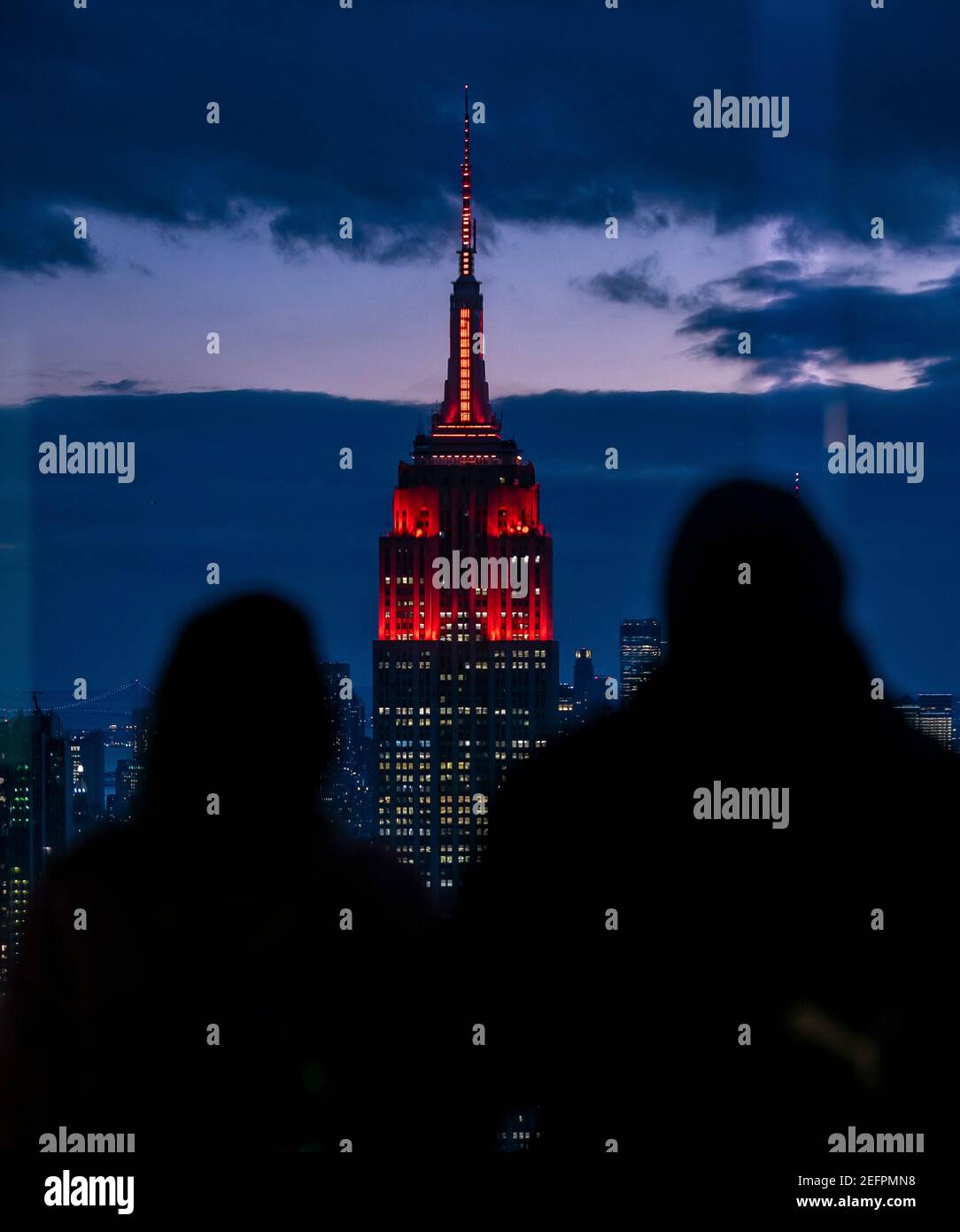 The Empire State Building is illuminated in red to celebrate the upcoming landing of the NASA Perseverance rover on the surface of Mars February 16, 2021 in New York City. Perseverance will search for signs of ancient microbial life. Credit: Planetpix/Alamy Live News Stock Photo