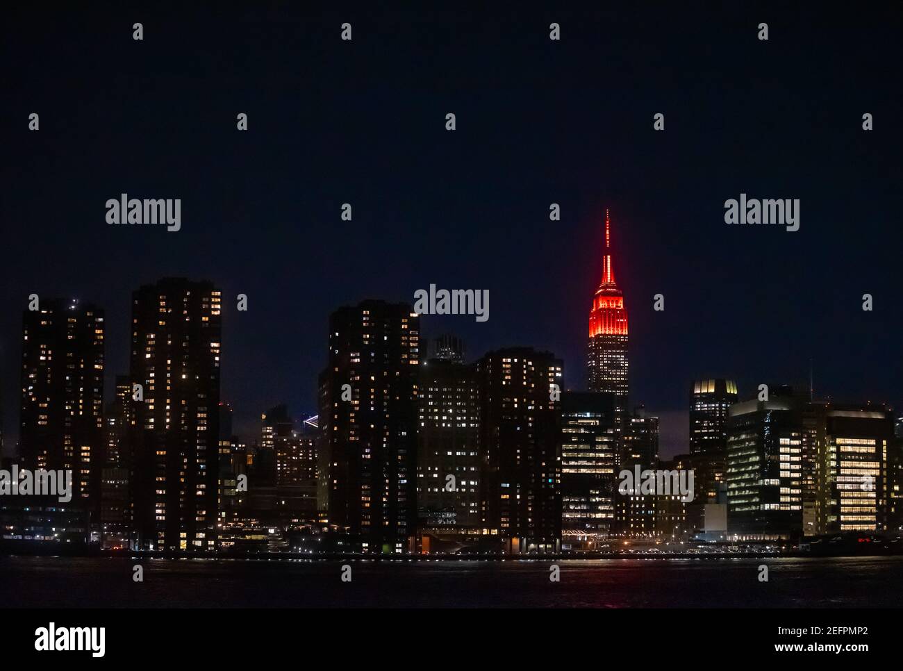 The Empire State Building is illuminated in red to celebrate the upcoming landing of the NASA Perseverance rover on the surface of Mars February 16, 2021 in New York City. Perseverance will search for signs of ancient microbial life. Credit: Planetpix/Alamy Live News Stock Photo