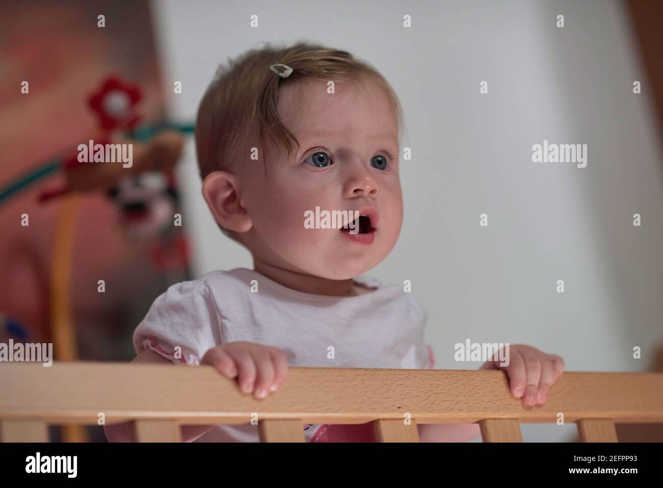 cute little one year old baby and making first steps in bed Stock Photo