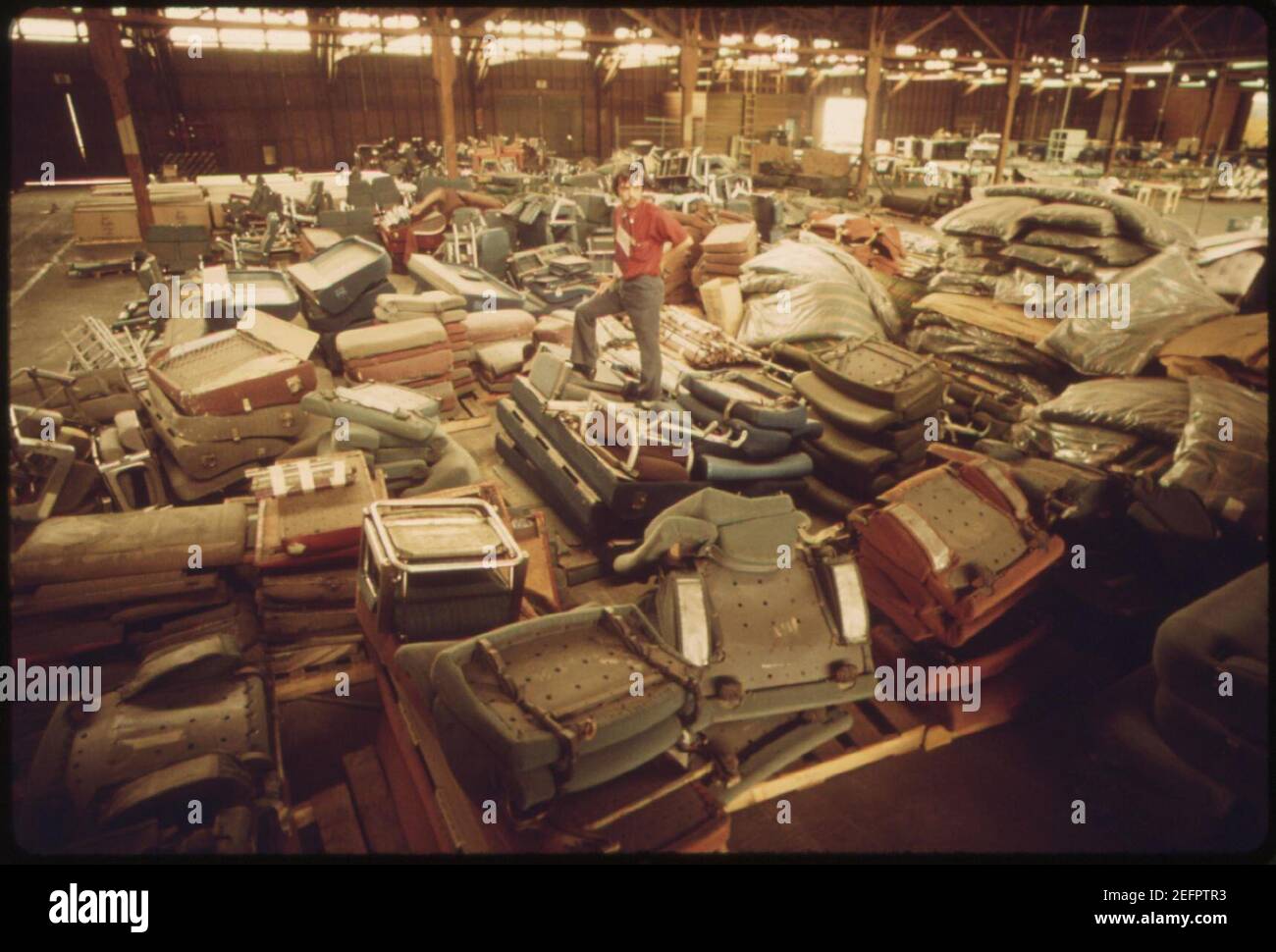 Old-equipment-from-amtrak-passenger-cars-is-piled-in-a-warehouse-may