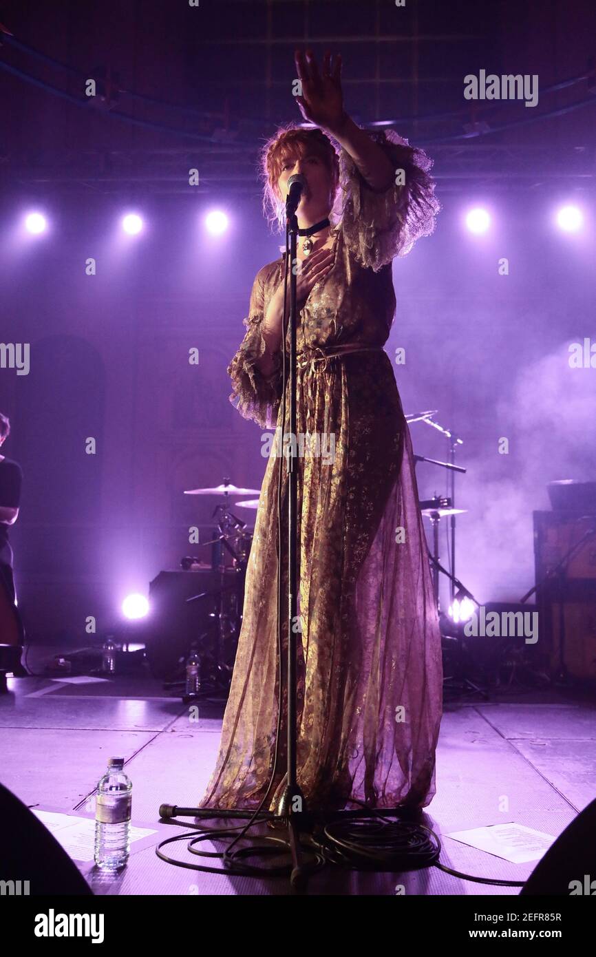 Florence Welch of Florence and the Machine performing live on stage at the War Child benefit gig at St John at Hackney Church in London as part of the Stock Photo