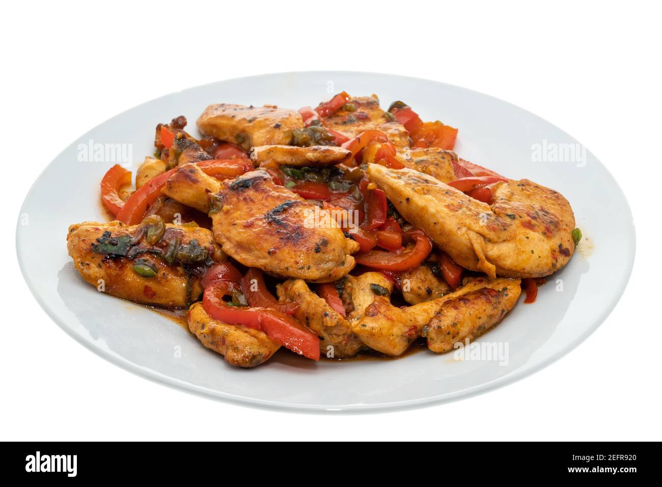 Chicken stir fry with red bell peppers, cabbage and onion - white background Stock Photo