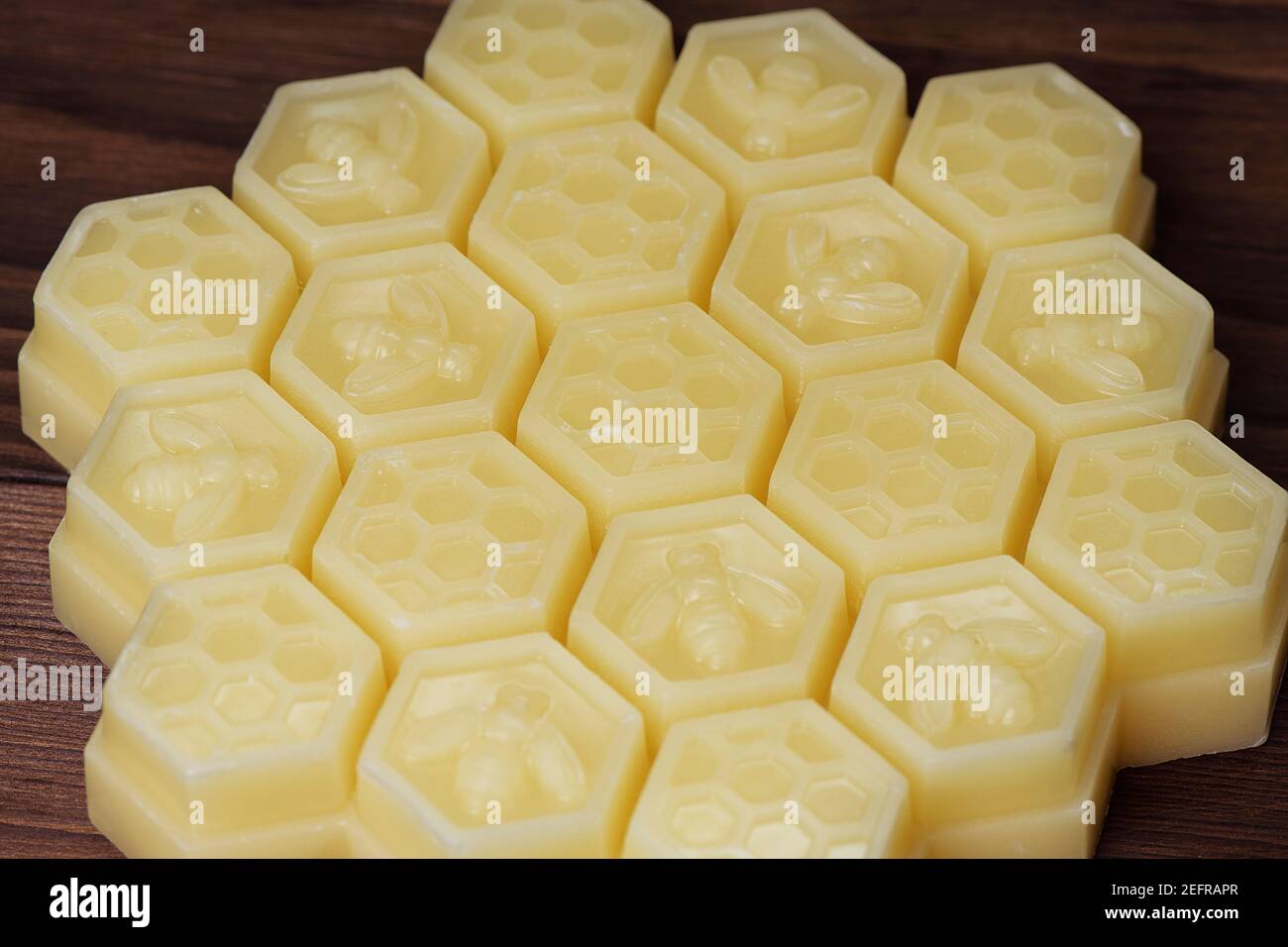 Natural Beeswax, Cera Alba, Bees Wax product in hexagon shaped clusters. Stock Photo