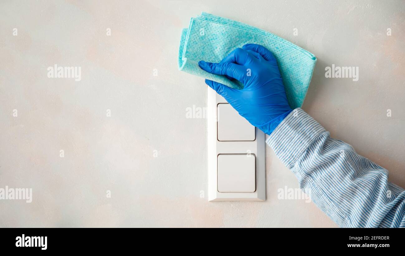 Woman In Rubber Blue Glove Clean Light Switch With Cloth On Wall By Wet Rag New Normal Covid 19 Coronavirus In Sanitize Home Cleaning Surfaces Disi Stock Photo Alamy