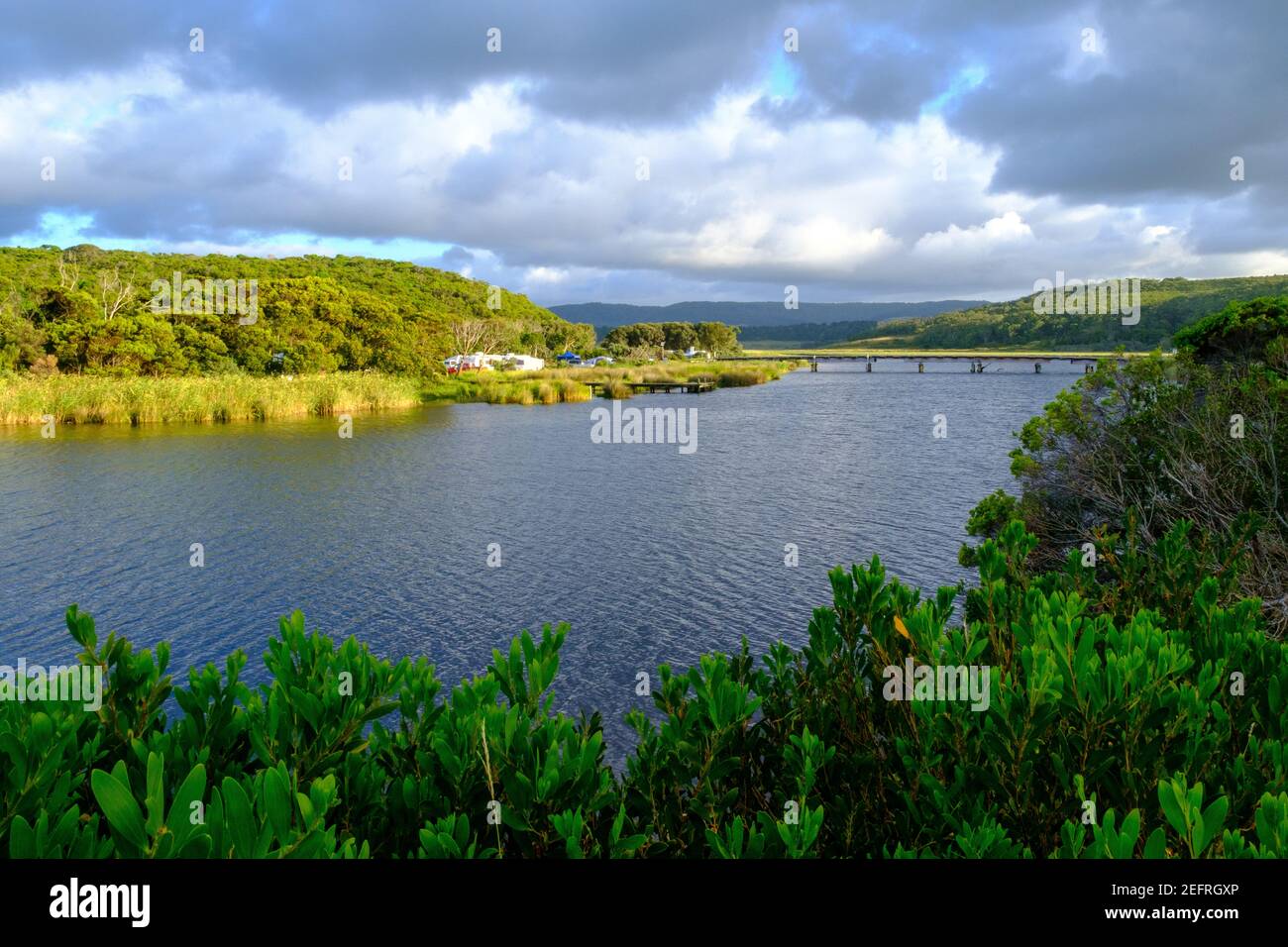 The view looking north along the Aire River with the camping ground and bridge in the background, Victoria, Australia Stock Photo