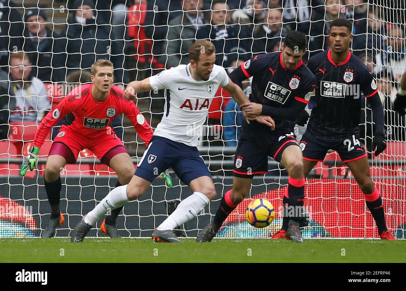 Soccer Football - Premier League - Tottenham Hotspur vs Huddersfield Town - Wembley Stadium, London, Britain - March 3, 2018   Tottenham's Harry Kane in action with Huddersfield Town’s Christopher Schindler    REUTERS/Eddie Keogh    EDITORIAL USE ONLY. No use with unauthorized audio, video, data, fixture lists, club/league logos or 'live' services. Online in-match use limited to 75 images, no video emulation. No use in betting, games or single club/league/player publications.  Please contact your account representative for further details. Stock Photo
