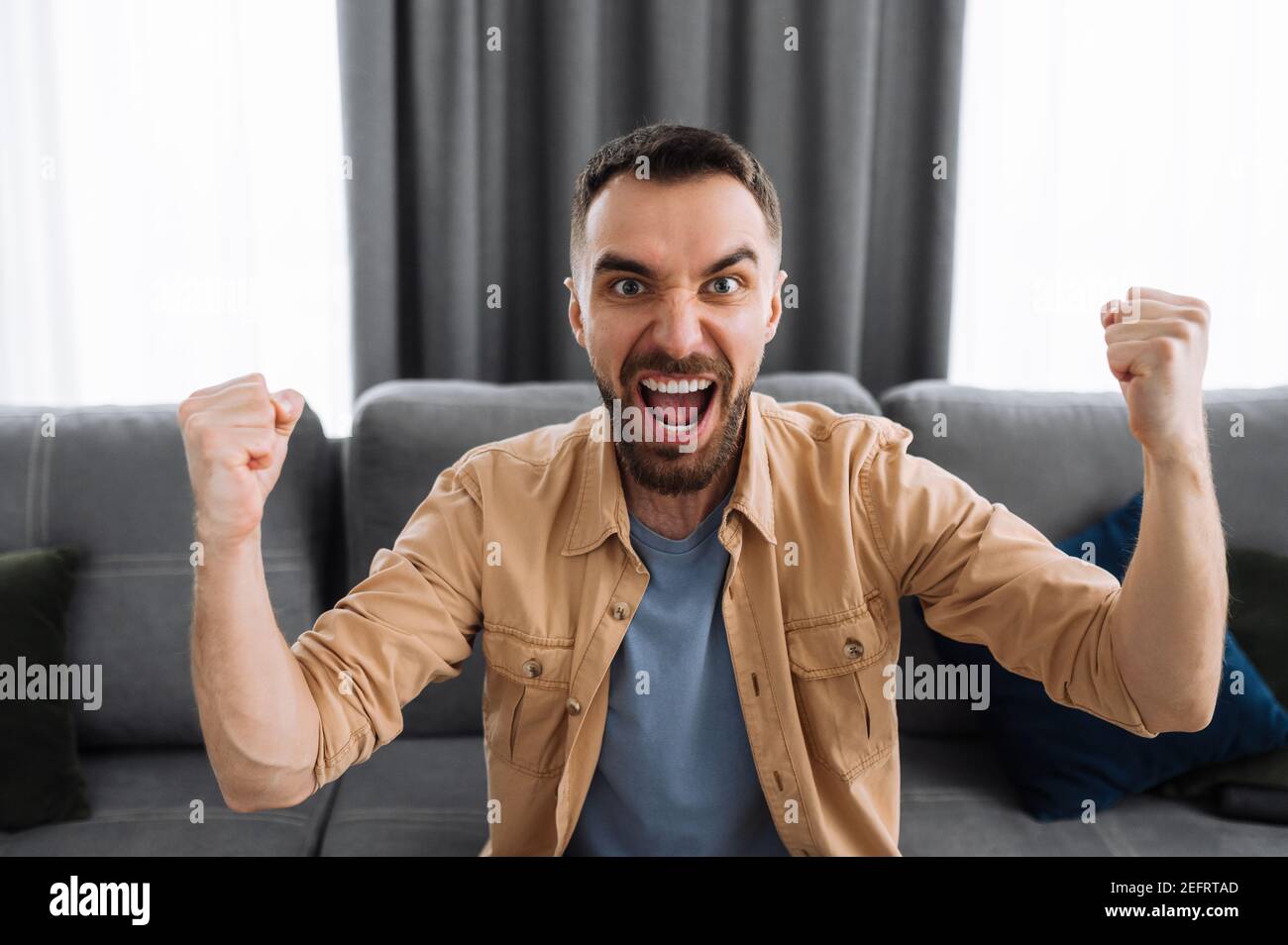 Cheering sofa hi-res stock photography and images - Alamy