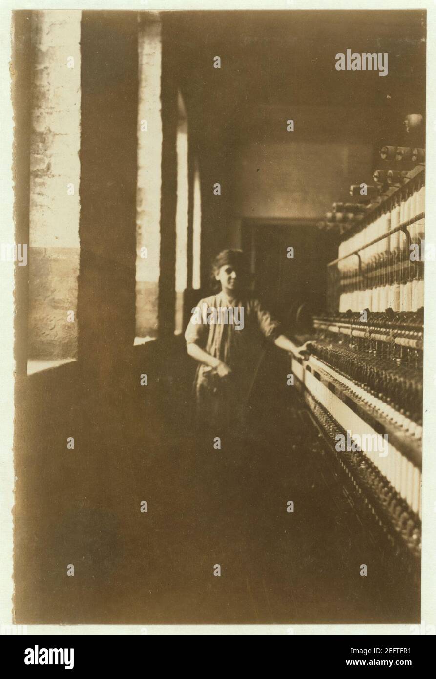 One of the little spinners in Amoskeag Mfg. Company, Manchester, N.H. She was about 48 inches high and about 11 or 12 years old. Stock Photo