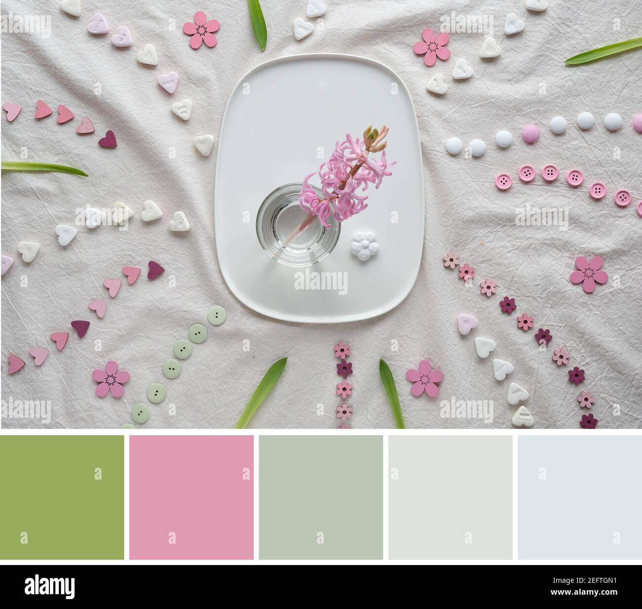 Color matching palette from image of Springtime background. Pink pearl hyacinth flower on ceramic plate. Flat lay with hearts, candy, buttons, small Stock Photo