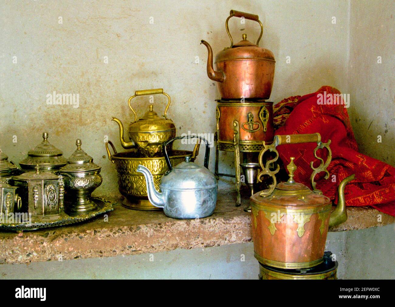 https://c8.alamy.com/comp/2EFW0XC/traditional-teapots-and-other-containers-in-a-moroccan-home-northern-morocco-1985-2EFW0XC.jpg