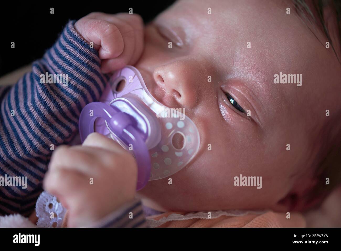 One month newborn baby sleeping in bed Stock Photo Alamy