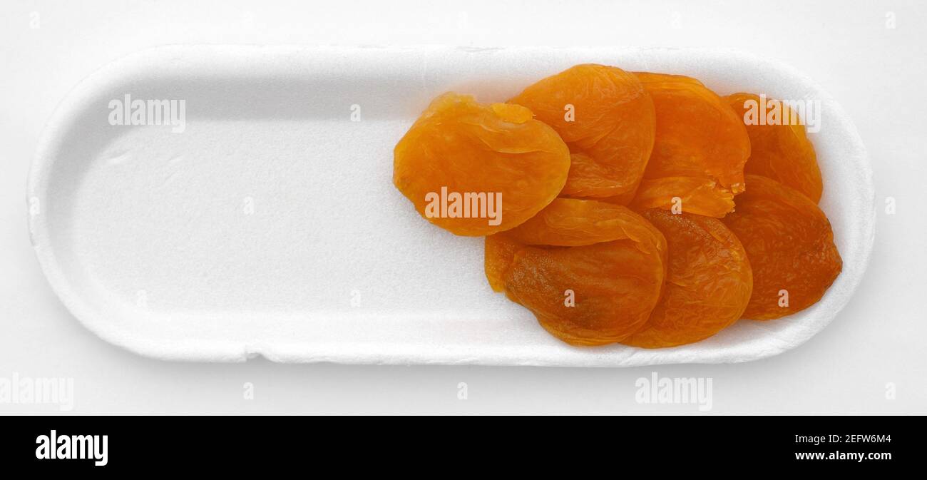 Dried apricots isolated on white background Stock Photo - Alamy