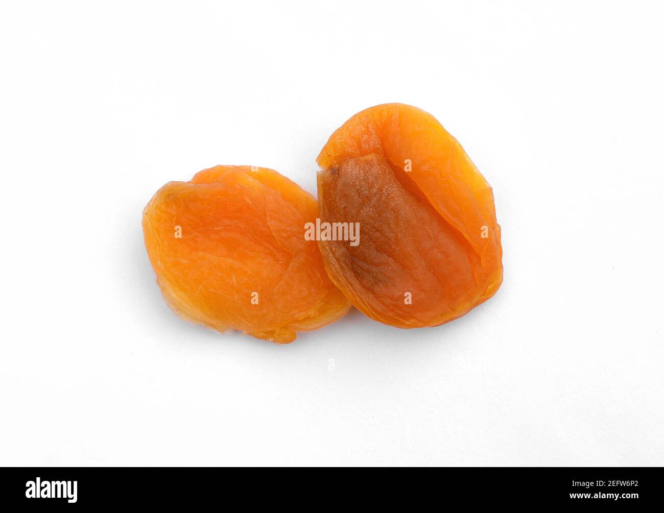 Dried apricots isolated on white background Stock Photo - Alamy