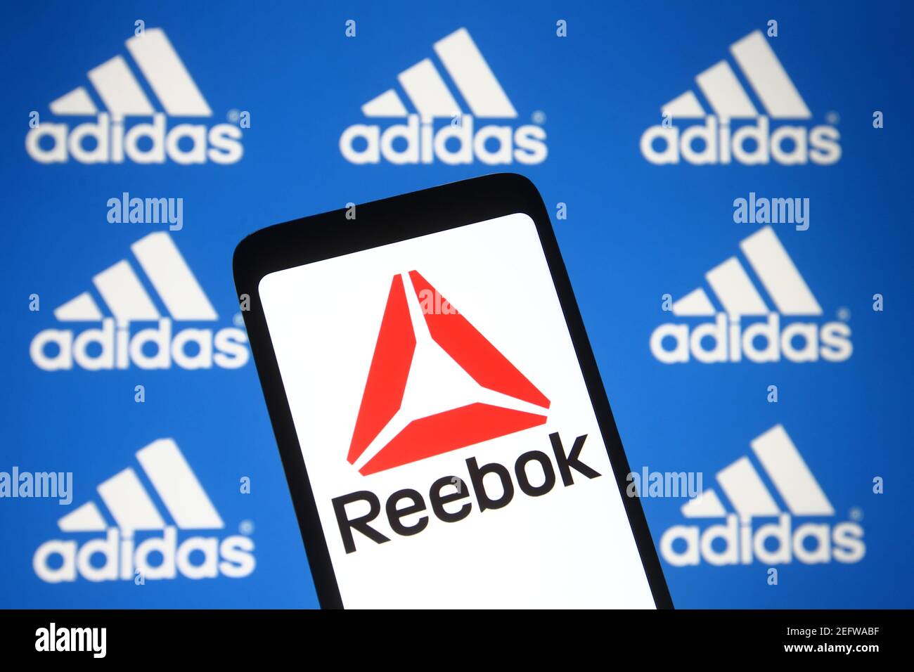 Ukraine. 17th Feb, 2021. In this photo illustration the Reebok logo seen on  a smartphone with an Adidas logo in the background. Credit: Pavlo  Gonchar/SOPA Images/ZUMA Wire/Alamy Live News Stock Photo -