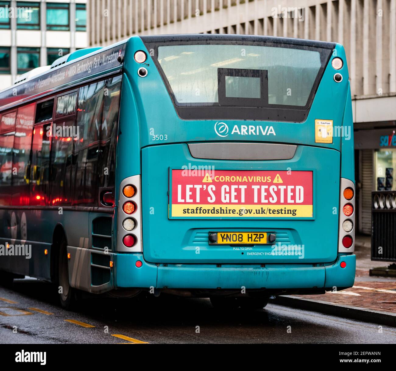 Coronavirus testing sign on the back of an Arriva bus, Staffordshire Stock Photo