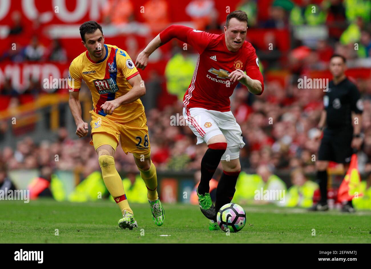 Britain Football Soccer - Manchester United v Crystal Palace - Premier League - Old Trafford - 21/5/17 Crystal Palace's Luka Milivojevic in action with Manchester United's Phil Jones  Action Images via Reuters / Jason Cairnduff Livepic EDITORIAL USE ONLY. No use with unauthorized audio, video, data, fixture lists, club/league logos or 'live' services. Online in-match use limited to 45 images, no video emulation. No use in betting, games or single club/league/player publications.  Please contact your account representative for further details. Stock Photo