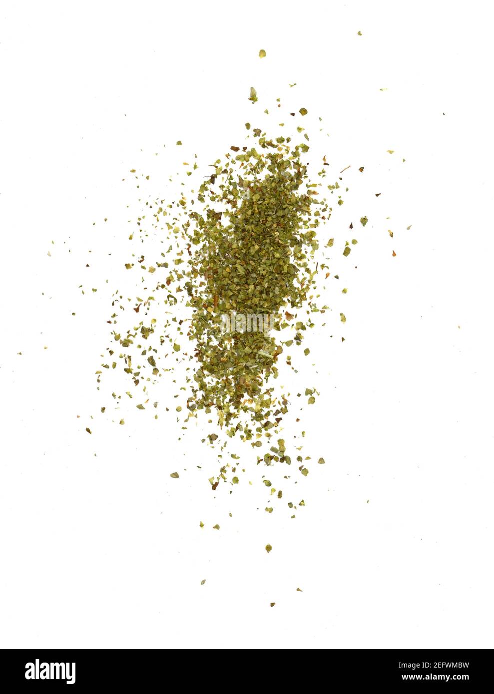 Dry marjoram spice (Origanum majorana). Heap of ground marjoram leaves isolated on white Stock