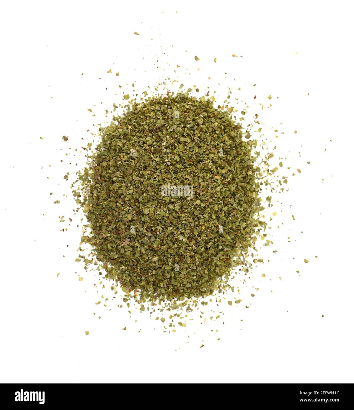 Dry marjoram spice (Origanum majorana). Heap of ground marjoram leaves