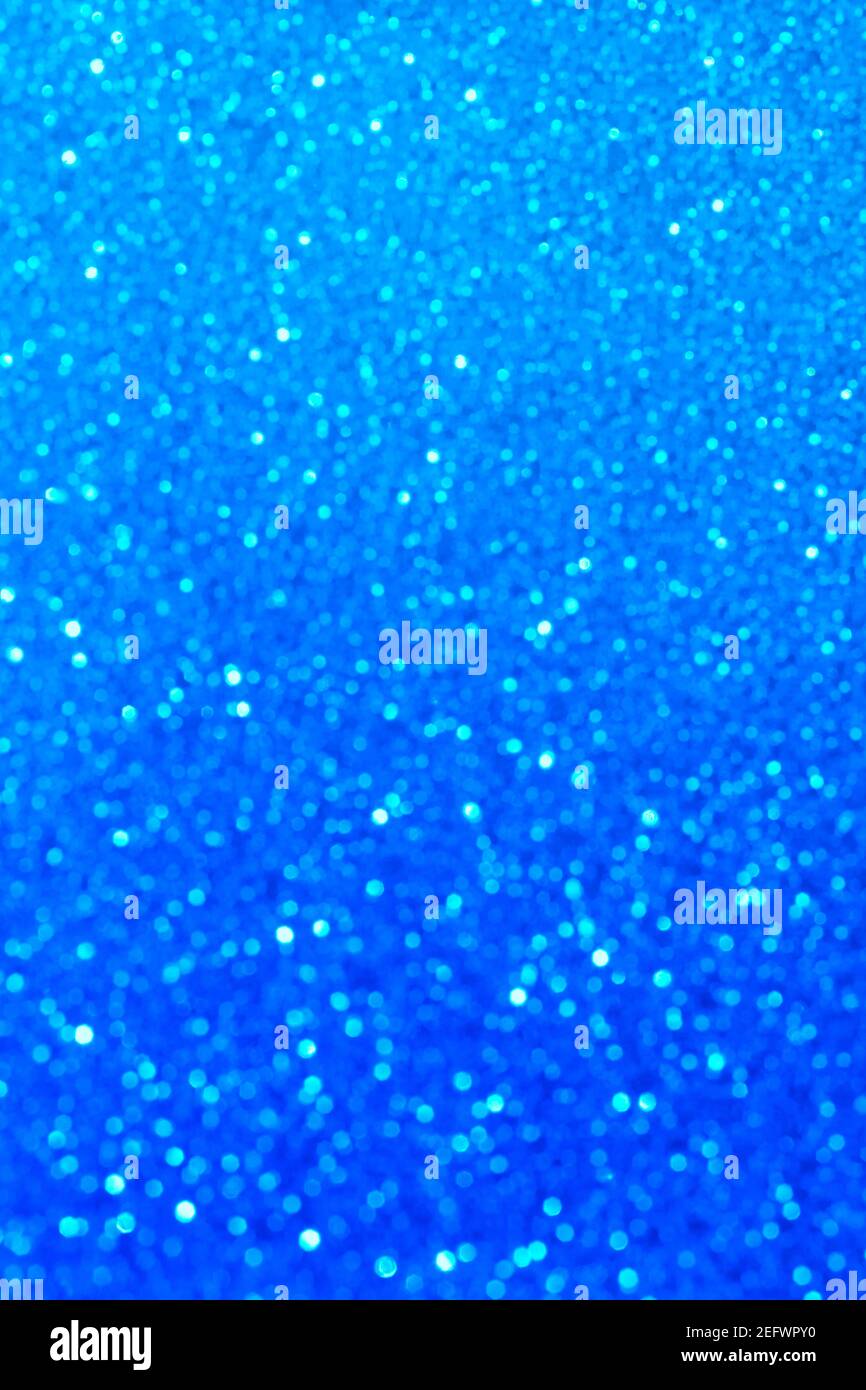 Abstract blue glitter lights background. Circle blurred bokeh. Festive ...