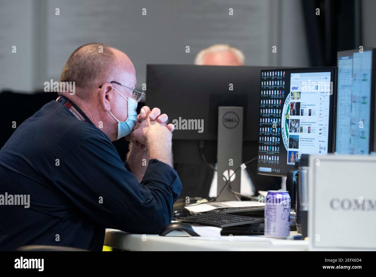 Austin, Texas Feb 17, 2021: Emergency officials confer in the State Operations Center, part of the Texas Division of Emergency Management, while Texas deals with record snow and bitter cold in all 254 counties. About a quarter of the state is still without power as officials deploy state resources on a multitude of fronts. Credit: Bob Daemmrich/Alamy Live News Stock Photo