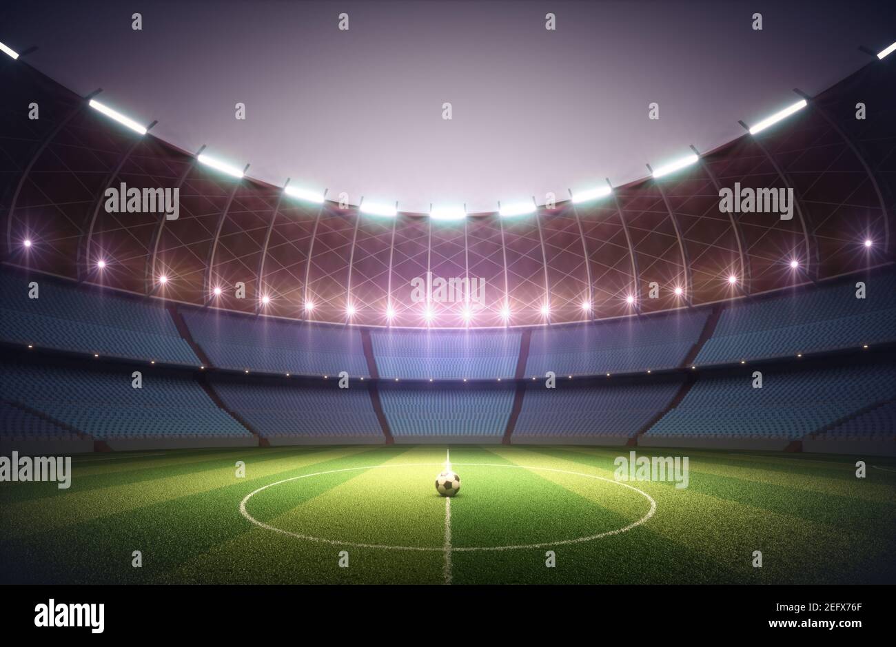 Soccer field in the sports stadium. Lawn illuminated in the center by
