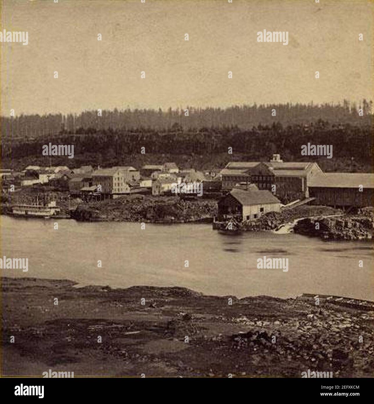 Oregon City below the falls, with steamboat and flour mills 1867
