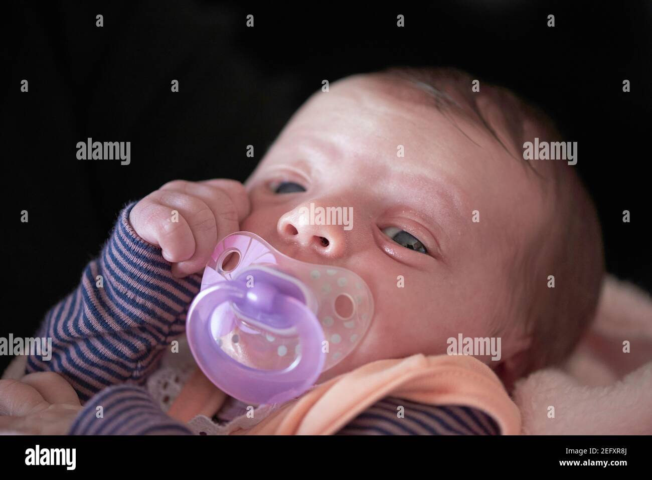 One month newborn baby sleeping in bed Stock Photo Alamy