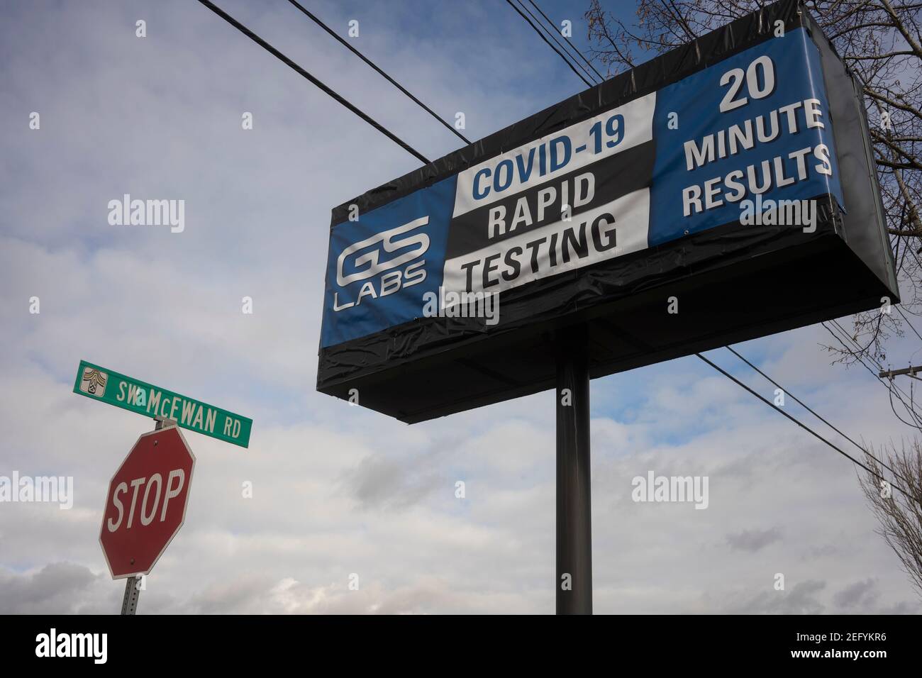 The COVID-19 Rapid Testing sign is seen outside the GS Labs Covid-19 Testing location in Lake Oswego, Ore., on 2/7/2021, amid the coronavirus pandemic. Stock Photo