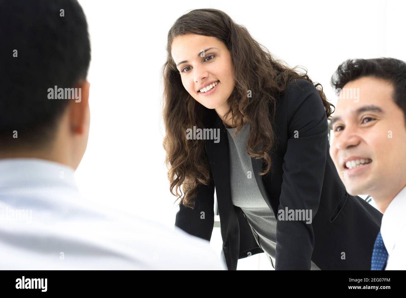 Female leader paying attention to her colleague at the meeting Stock Photo