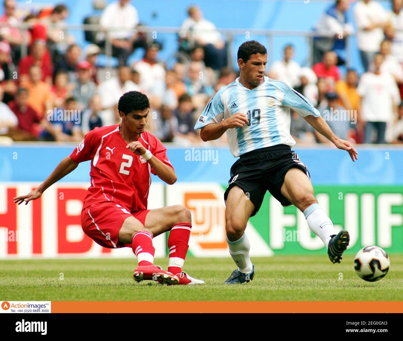 Football - Argentina v Tunisia FIFA Confederations Cup Germany 2005 Group A  - Cologne Stadium - 15/6/05 Tunisia's Karim Saidi and Argentina's Maxi  Rodriguez in action Mandatory Credit: Action Images / Andrew Couldridge  Livepic Stock Photo - Alamy