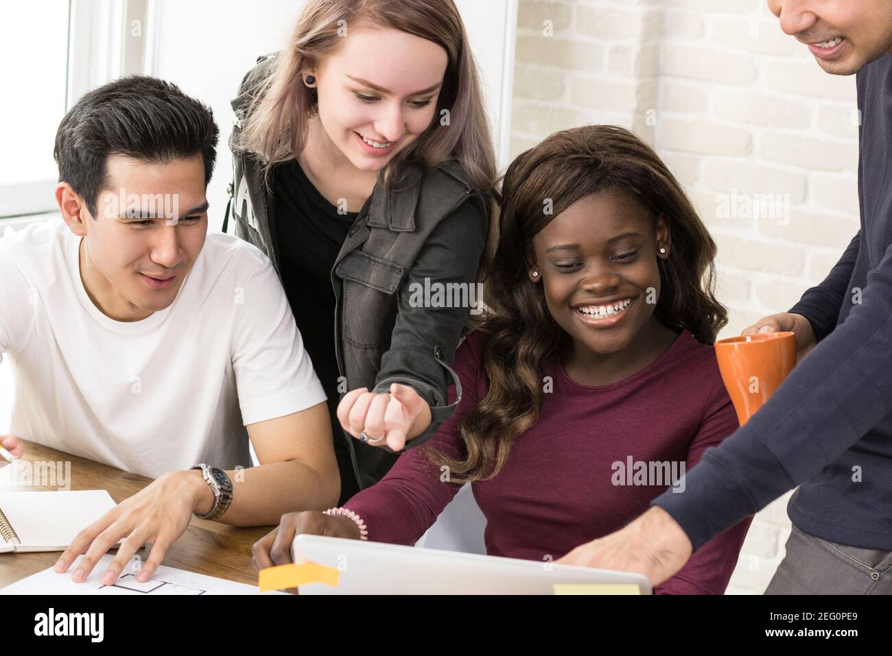 Group of multiethnic university students working together - education concept Stock Photo