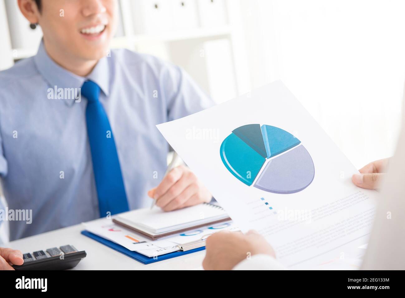 Business people discussing financial document Stock Photo