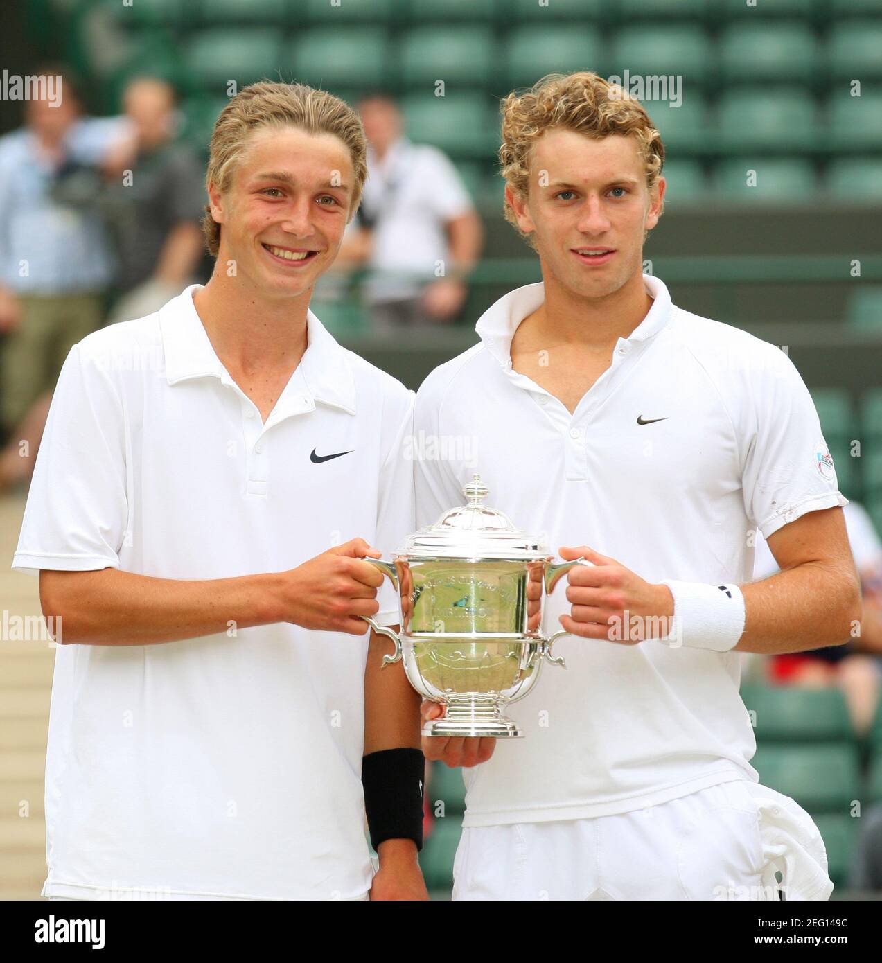 Tennis - Wimbledon - All England Lawn Tennis & Croquet Club, Wimbledon,  England - 4/7/10 Great Britain's Liam Broady and Tom Farquharson (R)  celebrate with the trophy after winning the Boy's Doubles