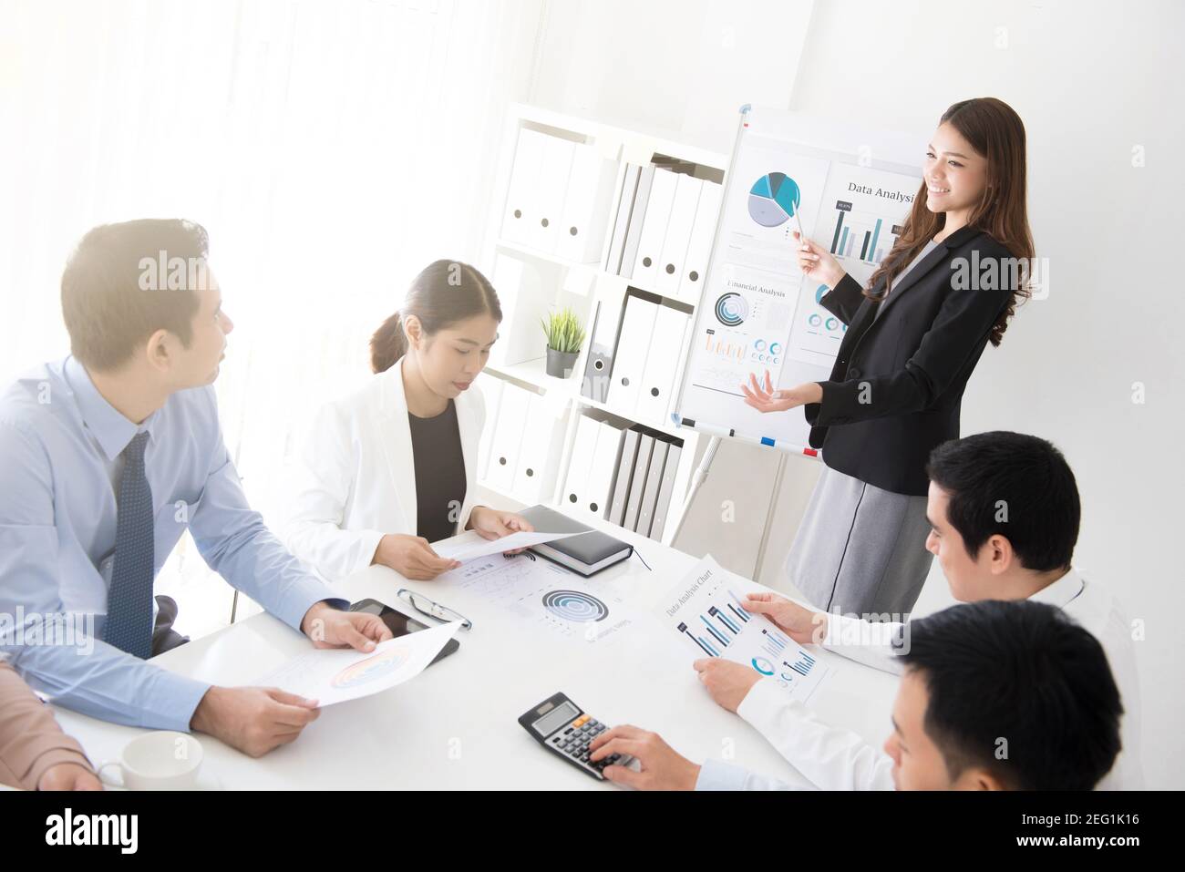 Asian business woman presenting her work in the meeting Stock Photo