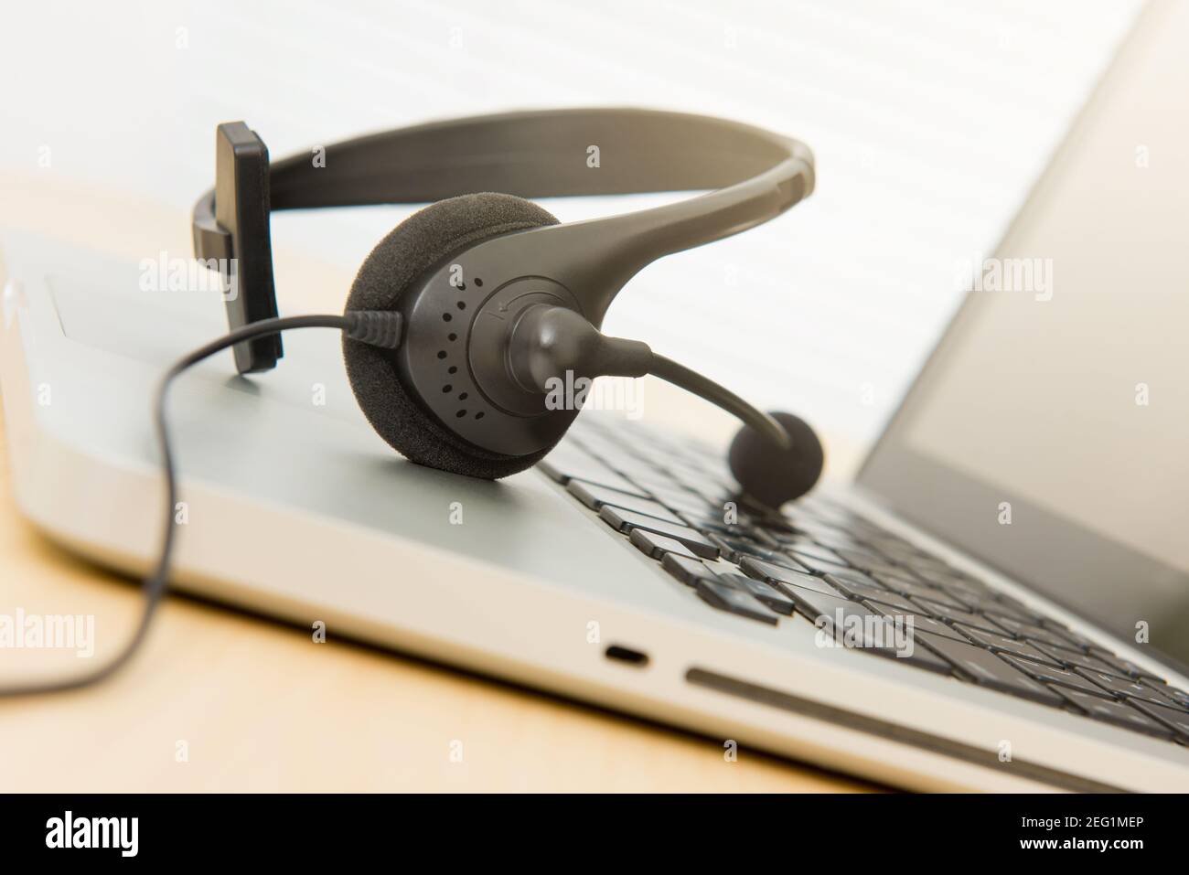 Microphone headset on laptop computer Stock Photo Alamy