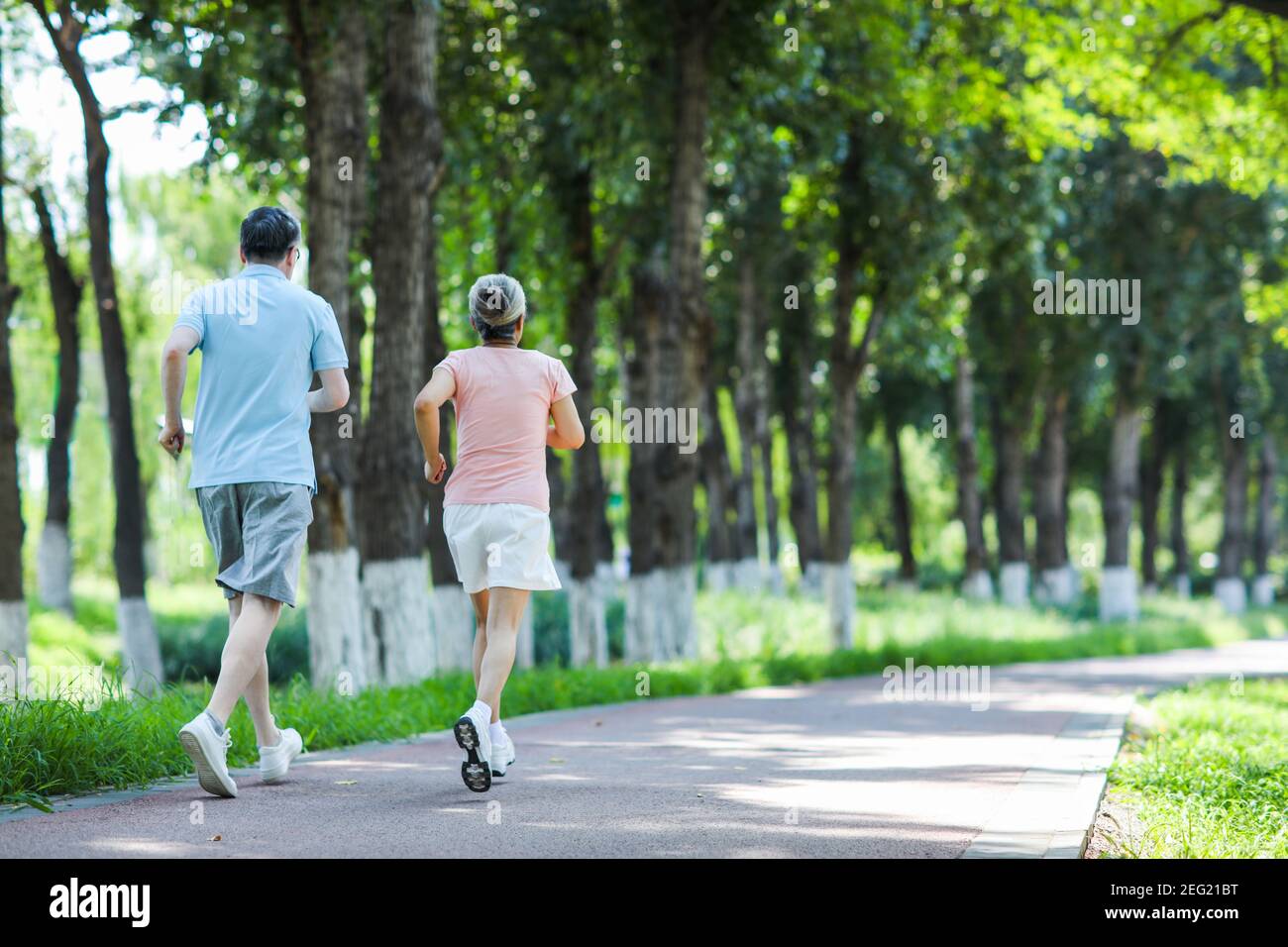 Back view woman jogging on hi-res stock photography and images - Alamy