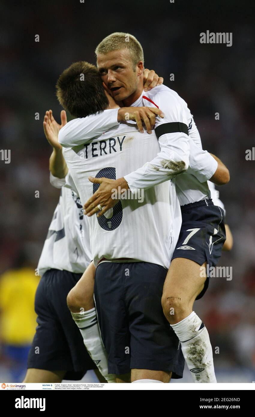 Football action scoring david beckham hires stock photography and