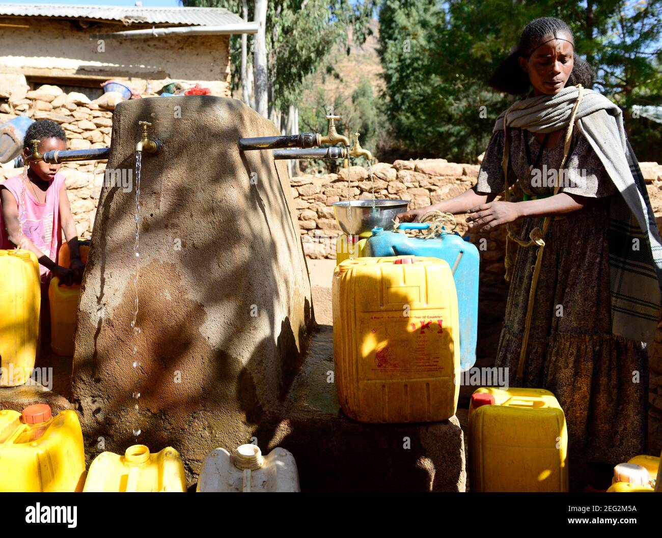 Local Tigrayans filling jerrycans of water in their village water pump