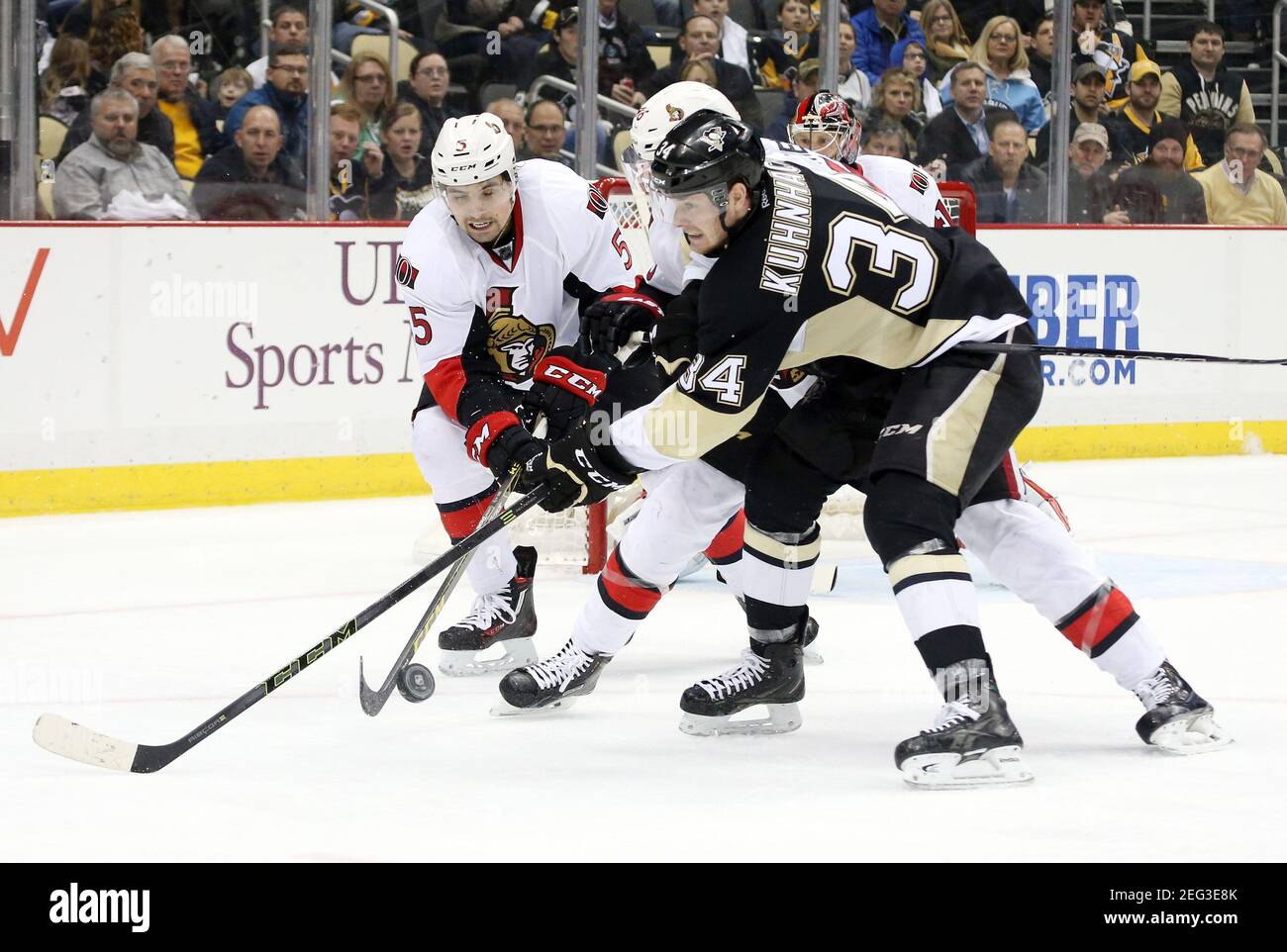 Feb 2 2016 Pittsburgh Pa Usa Ottawa Senators Defenseman Cody Ceci 5 And Pittsburgh Penguins Right Wing Tom Kuhnhackl 34 Battle For The Puck During The Second Period At The Consol Energy