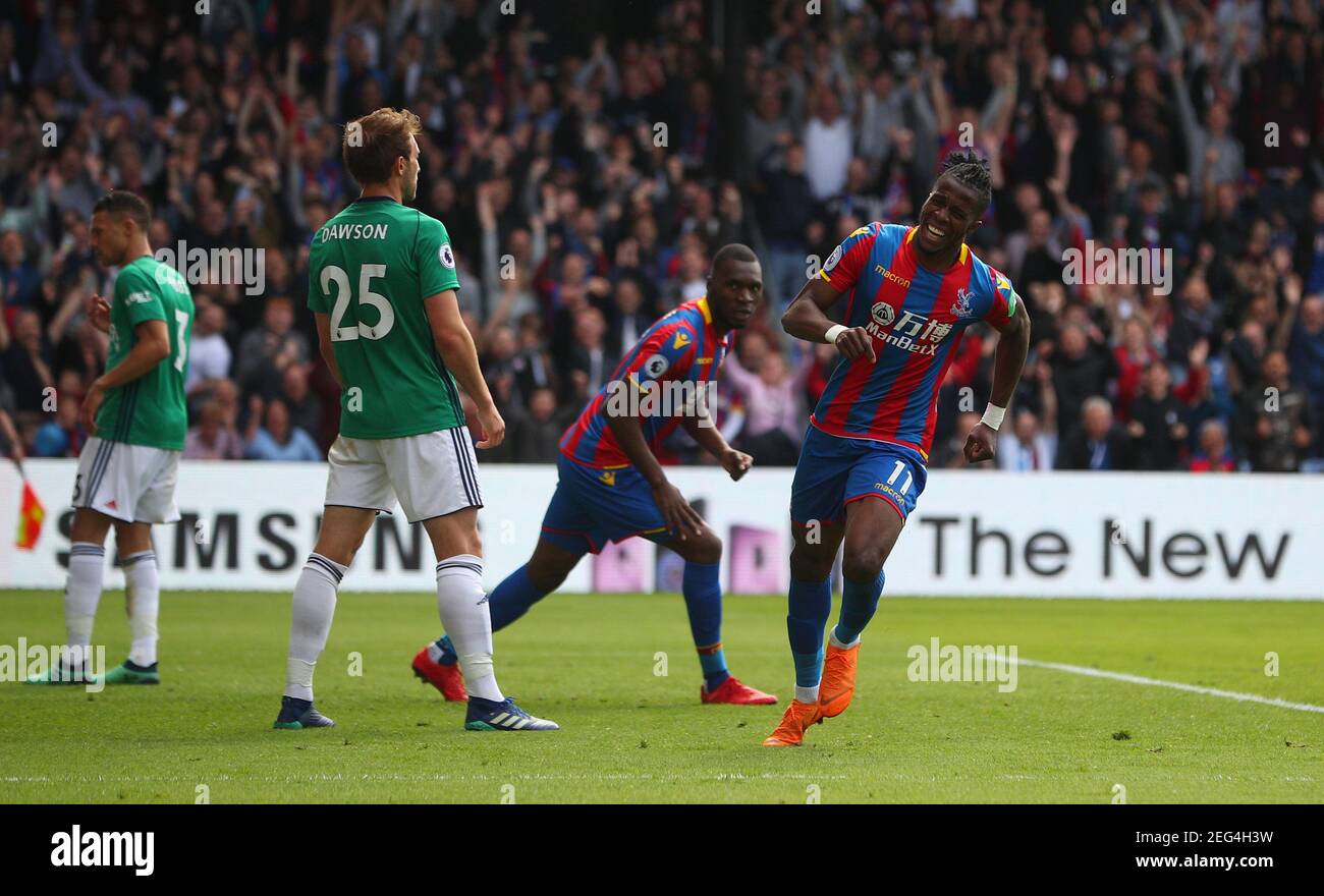Soccer Football - Premier League - Crystal Palace vs West Bromwich Albion - Selhurst Park, London, Britain - May 13, 2018   Crystal Palace's Wilfried Zaha celebrates scoring their first goal    REUTERS/Hannah McKay    EDITORIAL USE ONLY. No use with unauthorized audio, video, data, fixture lists, club/league logos or "live" services. Online in-match use limited to 75 images, no video emulation. No use in betting, games or single club/league/player publications.  Please contact your account representative for further details. Stock Photo